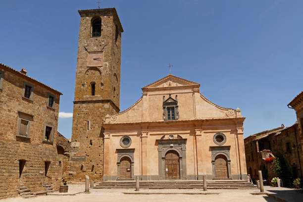 Main square of Civita di Bagnioregio with Church of San Donato in Italy stock photo