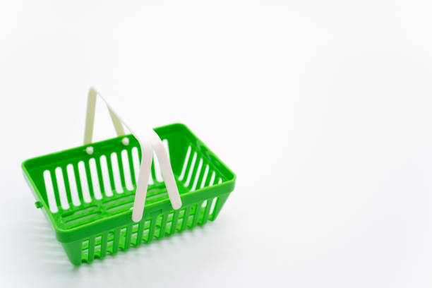 Green shopping basket on white background