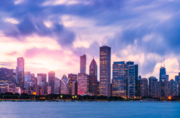 istock Chicago skyline at sunset with cloudy sky and reflection in water. 1224976596