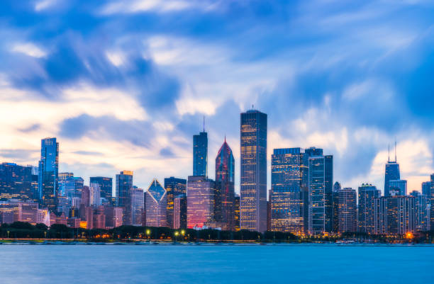 istock Chicago skyline at sunset with cloudy sky and reflection in water. 1224976597