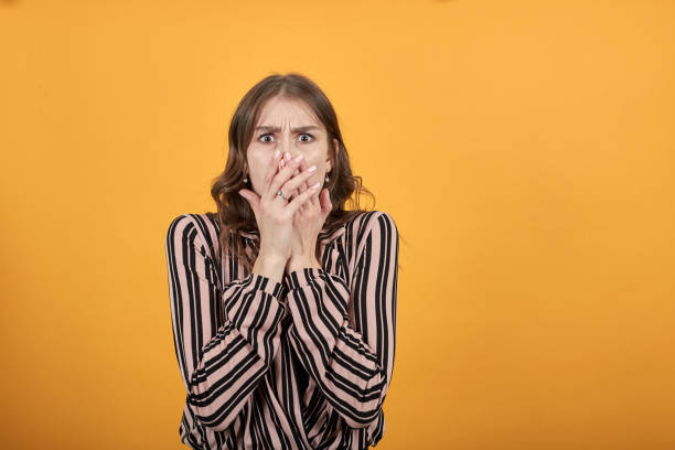 istock Scared Girl Afraid, Covered Her Mouth With Hands 1224977077