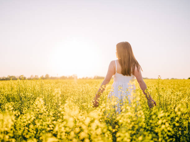 istock Girl posing in the rapeseed field 1224977879