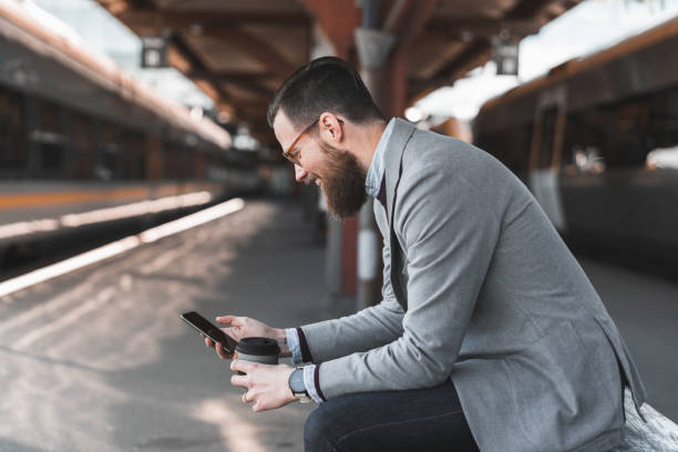 istock Commuting businessman with a smart phone 1224978335