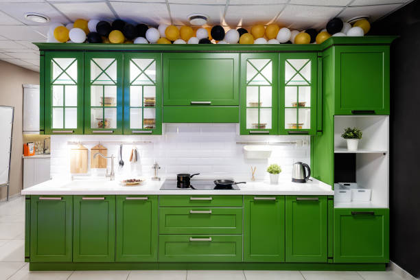 istock Classic kitchen interior with green trim. Kitchen acrylic countertop with built-in sink. 1224979875