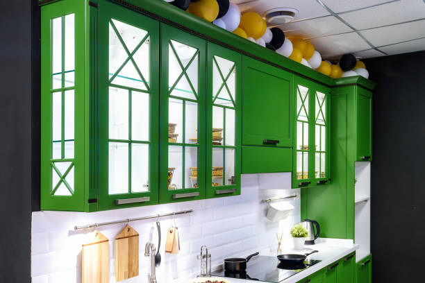 istock Classic kitchen interior with green trim. Kitchen acrylic countertop with built-in sink. 1224979886