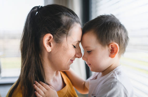 istock Mother and child indoors at home, hugging. 1224981612