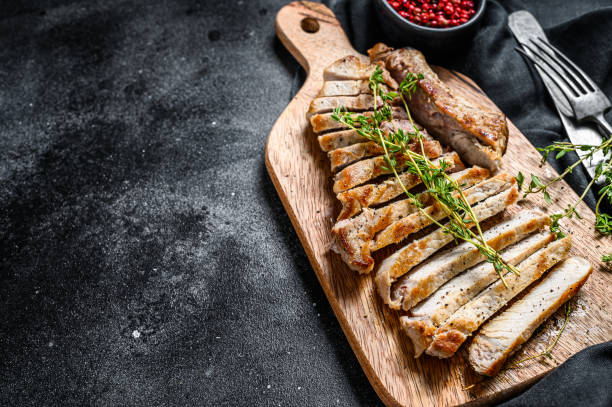 istock Grilled pork rib chop steak. Organic meat. Black background. Top view. Copy space 1224982004