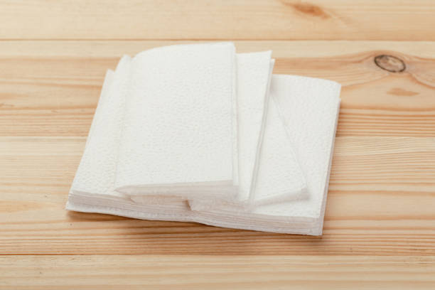 istock white paper napkin or tissue on the wooden table background. 1224983989