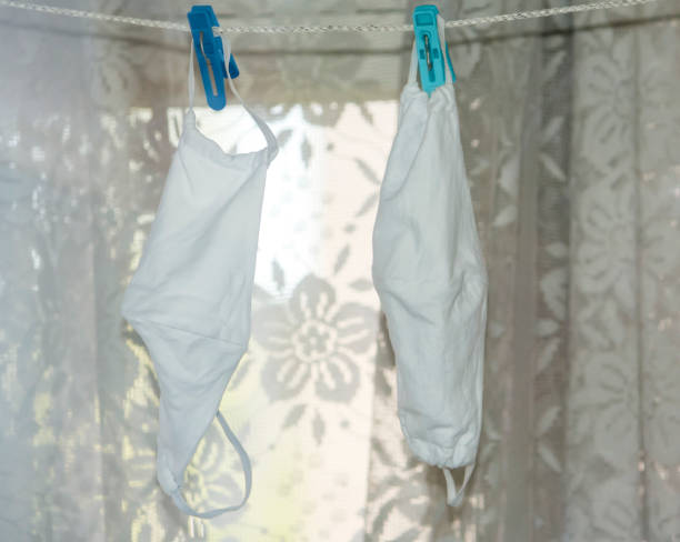 istock washed reusable protective masks are dried on a clothesline 1224984277