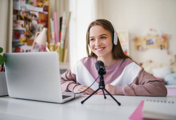 istock Young female student with laptop at the table, online lesson concept. 1224995954