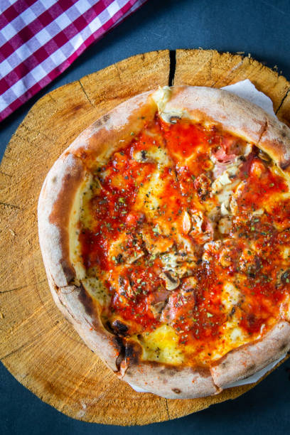 istock Pizza on a wooden board 1224996034