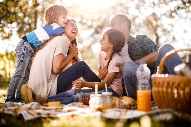 istock Cheerful family having fun on a picnic in spring day. 1224996312