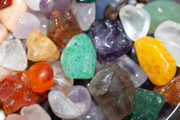 istock Crystal Stone Alternative Lifestyle Healing Chips in Quartz and Amethyst on White Background 1225002207