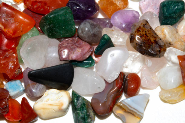 istock Crystal Stone Alternative Lifestyle Healing Chips in Quartz and Amethyst on White Background 1225002256