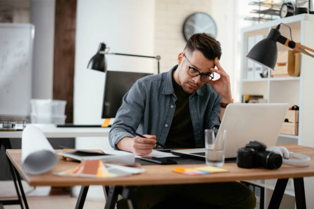 istock Angry businessman working in office. 1225002461