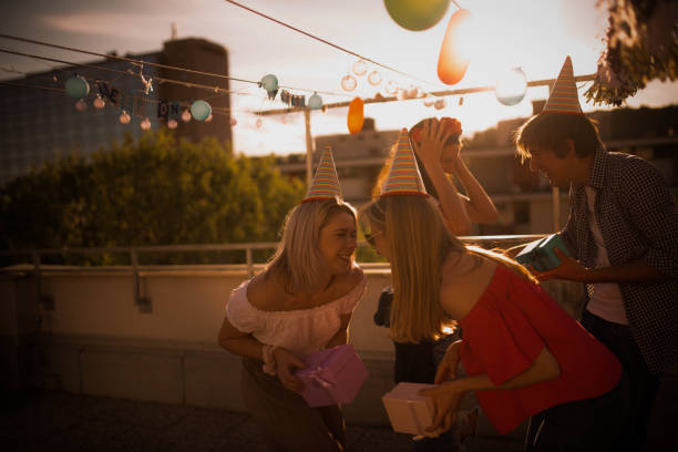 istock Group of young people partying on the rooftop 1225005911