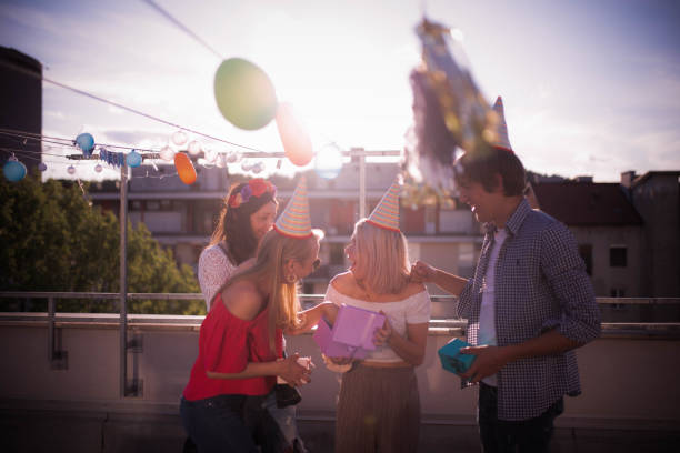 istock Group of young people partying on the rooftop 1225005948