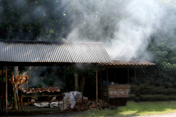 A wider scene of business stall selling smoked duck at roadside during partial lockdown in Malaysia. This type of gourmet is very popular among Malaysian Muslim during Ramadan month.
