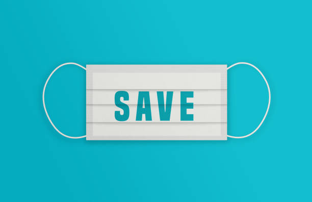 istock White Protective Mask with SAVE message over the blue background. 1225008707