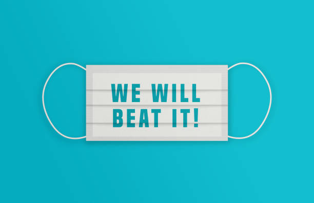 istock White Protective Mask with We Will Beat It message over the blue background. 1225009100