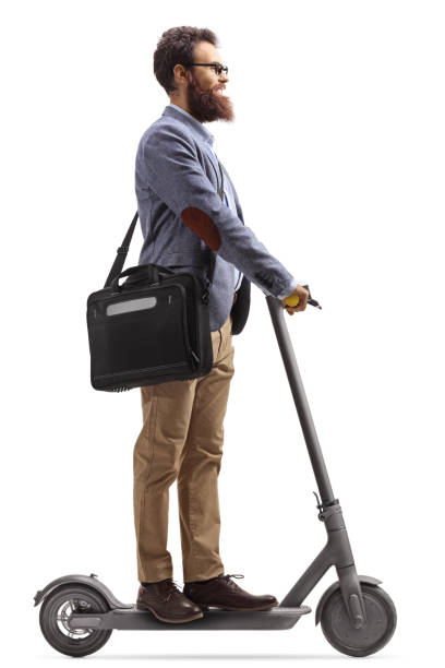 istock Man with a laptop case going to work with an electric scooter 1225010226