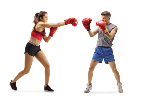 istock Young guy and woman training boxing 1225010245