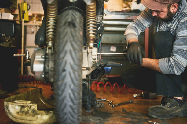 istock A person is working in motorcycle service and repair, Outbreak measures 1225010279
