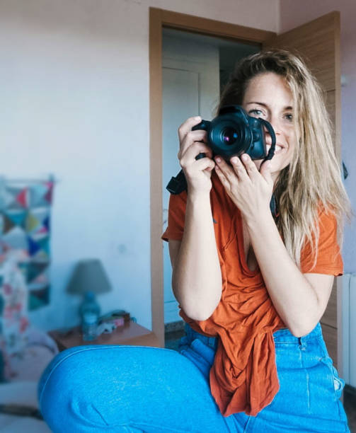 istock girl photographer with camera taking photos 1225011777