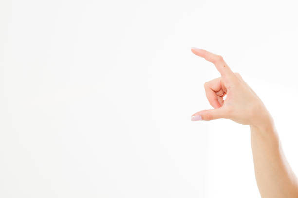 istock female hand measuring invisible items, woman's palm making gesture while showing small amount of something on white isolated background, side view, close-up, cutout, copy space 1225011907