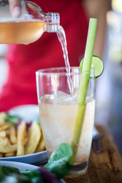 Woman Pouring Kombucha
