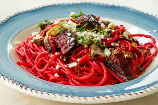 Beet Spaghetti Pasta with Beetroot Slices, Feta Cheese, Walnut and Dill. Homemade Healthy Organic Food.