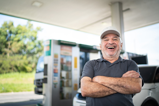Portrait of a senior man at a gas station