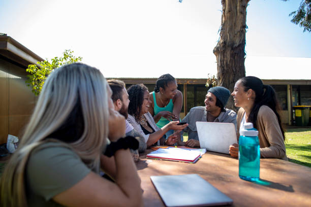 studieren in der sonne - australia aborigine group of people friendship stock-fotos und bilder