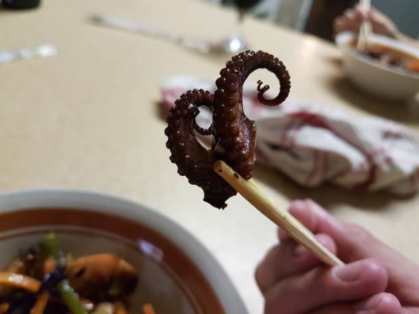 Octopus tentacle in chopsticks