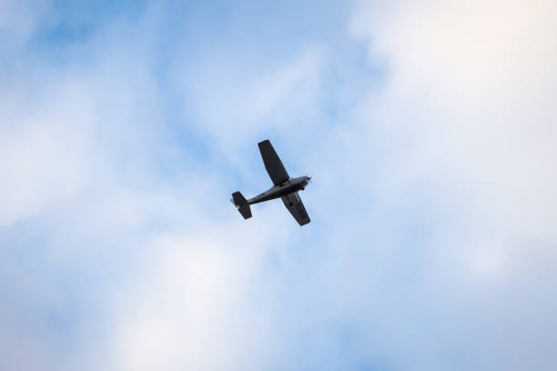 istock Small plane flying on the background of clouds. 1225022287