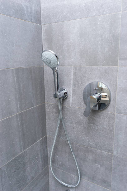 istock Shower head with grey wall tiles 1225024182