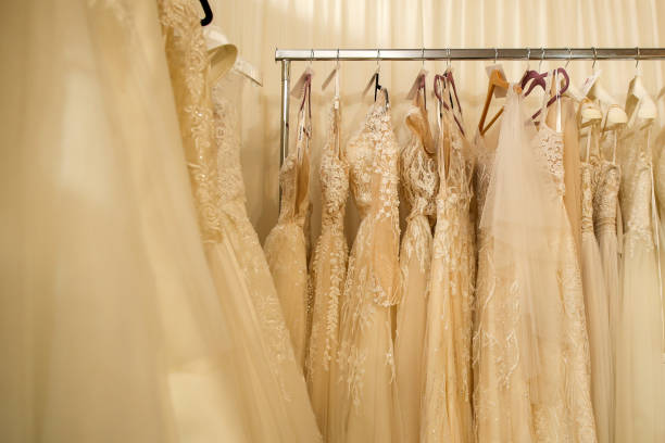 istock wedding dress hanging on hangers 1225025762