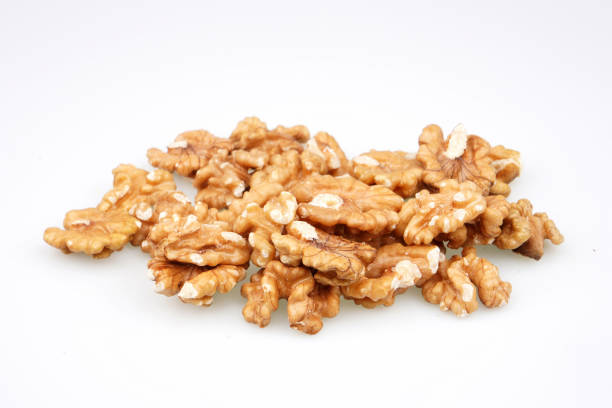 istock Organic Tasty walnuts isolated on white background 1225026592
