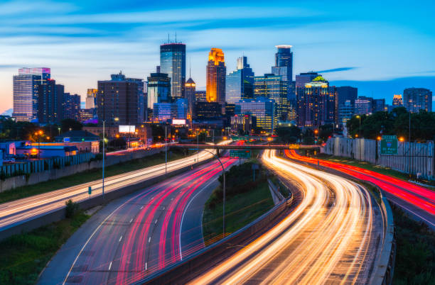 Minneapolis skyline with traffic light at night. Minneapolis skyline with traffic light at night. minneapolis stock pictures, royalty-free photos & images