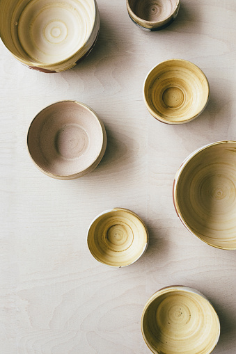 From above photo of handmade ceramic bowls.