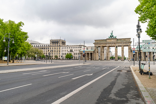 Berlin, Germany - May 3, 2020: The historic Brandenburg Gate is a landmark of Berlin, as seen from the Straße des 17. Juni, in central Berlin, Germany
