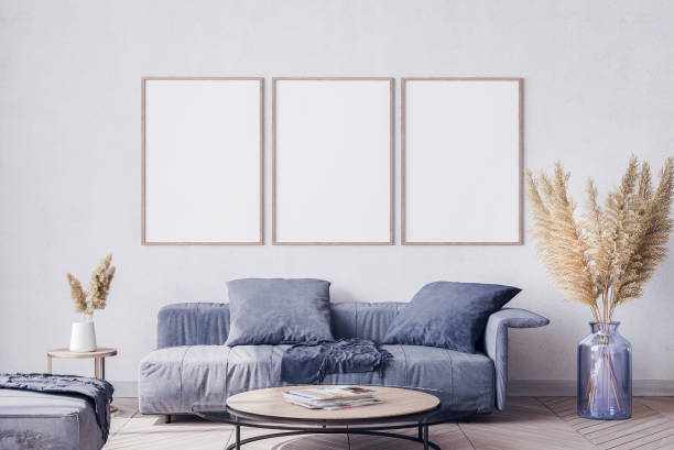 Blue living room interior design Blue living room on white background with three empty wooden frames and trendy home accessories pampas photos stock pictures, royalty-free photos & images