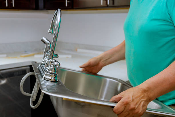 istock Male plumber prepared to instal kitchen sink 1225031549