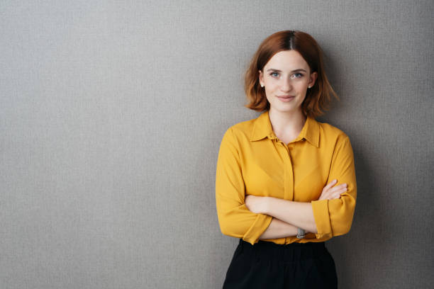 istock Friendly confident young woman over grey 1225032830