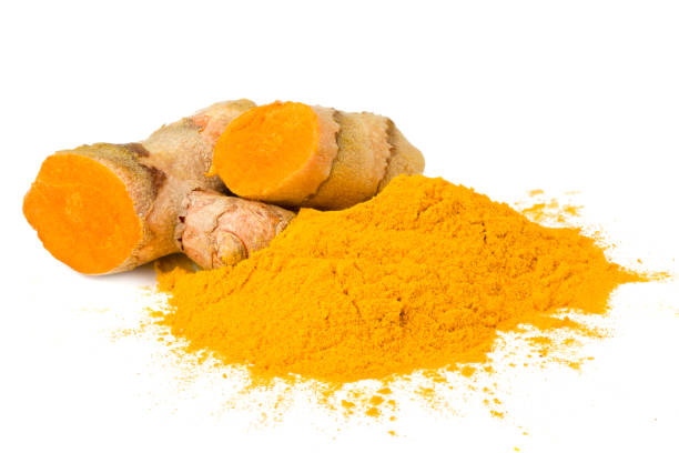 istock Turmeric powder with turmeric root isolated on white background 1225034291