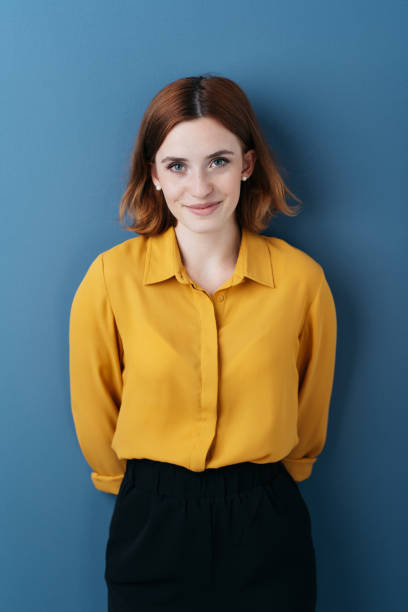 istock Happy smiling young woman posing over blue 1225034348