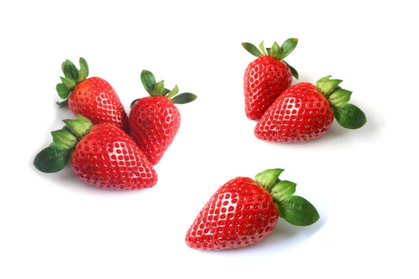 istock Fresh ripe strawberries scattered on white background 1225035604