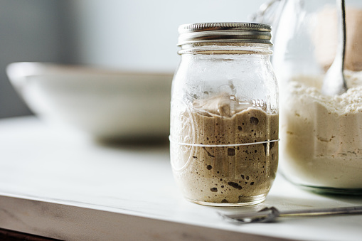 Close-up of sourdough starter in jar on counter