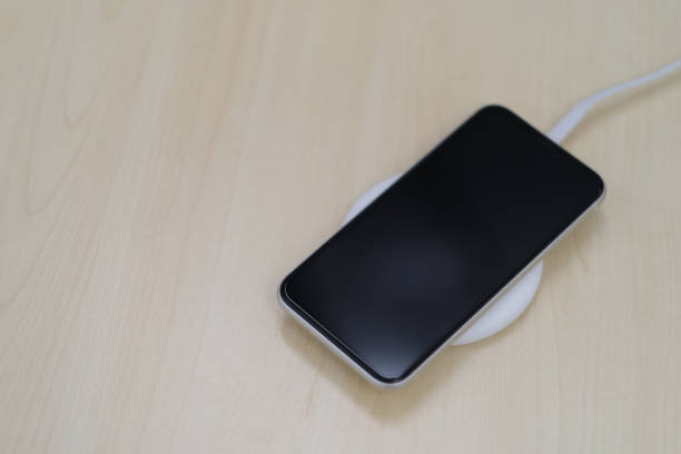 istock top down view of one smartphone on wireless charger. 1225037618