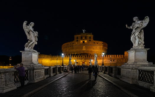 Rome, Italy - September 26, 2016: Night view of Castel Sant'Angelo from Sant'Angelo bridge.This photograph was taken at night with full frame camera and Zeiss wide-angle lens.